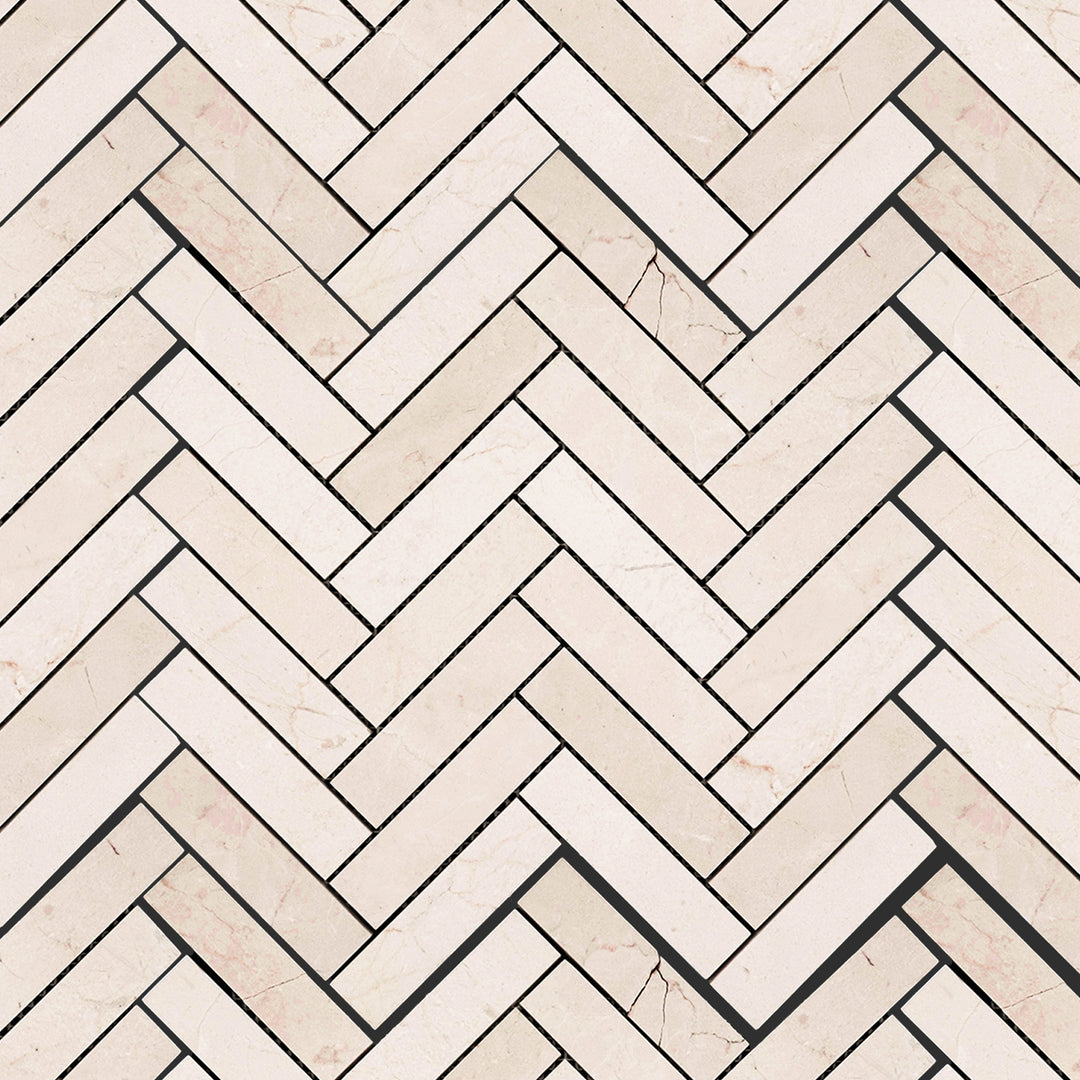 Crema Marfil Marble 1x4 herringbone honed mosaic arranged in an elongated pattern emphasizing smooth matte elegance.