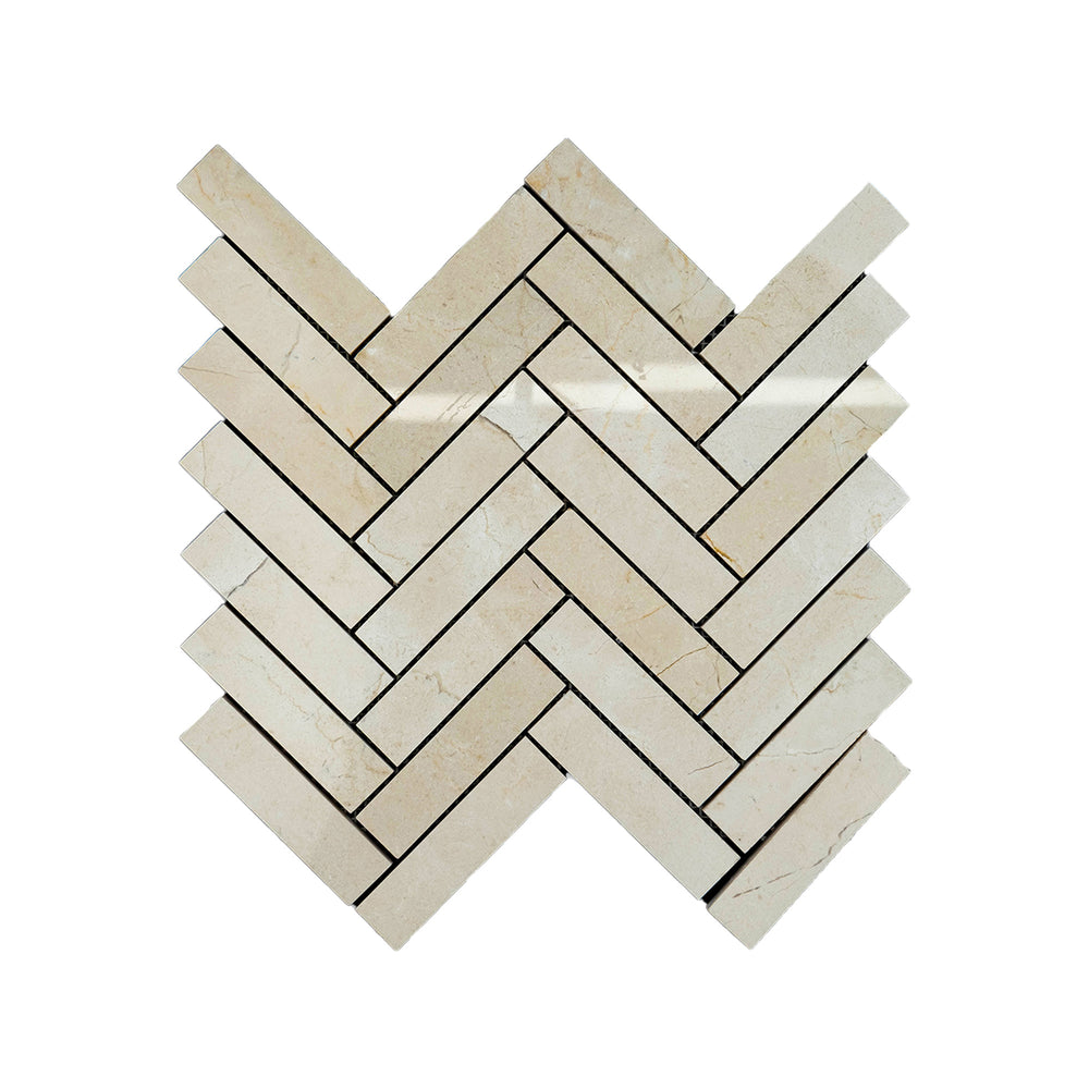 Overhead image of Crema Marfil Marble 1x4 herringbone mosaic in a polished finish, offering shine and sophistication in an elongated herringbone pattern.