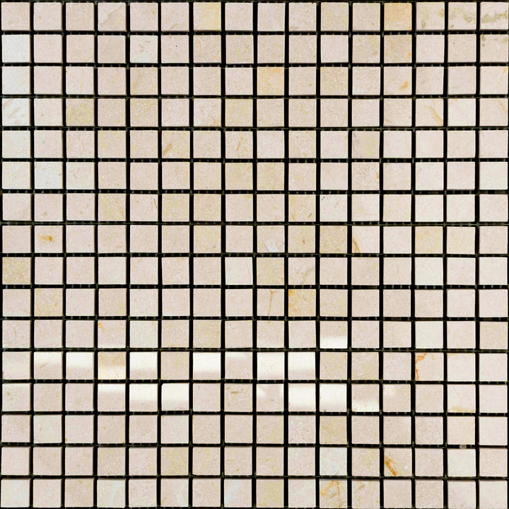 Polished 5/8" square mosaic tiles of Crema Marfil Marble shown in an overview layout to enhance shine and density.