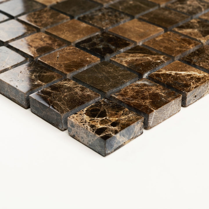 1 inch square Emperador Dark marble mosaic with polished surface, presented corner-on to highlight its refined grid layout and rich espresso hues.