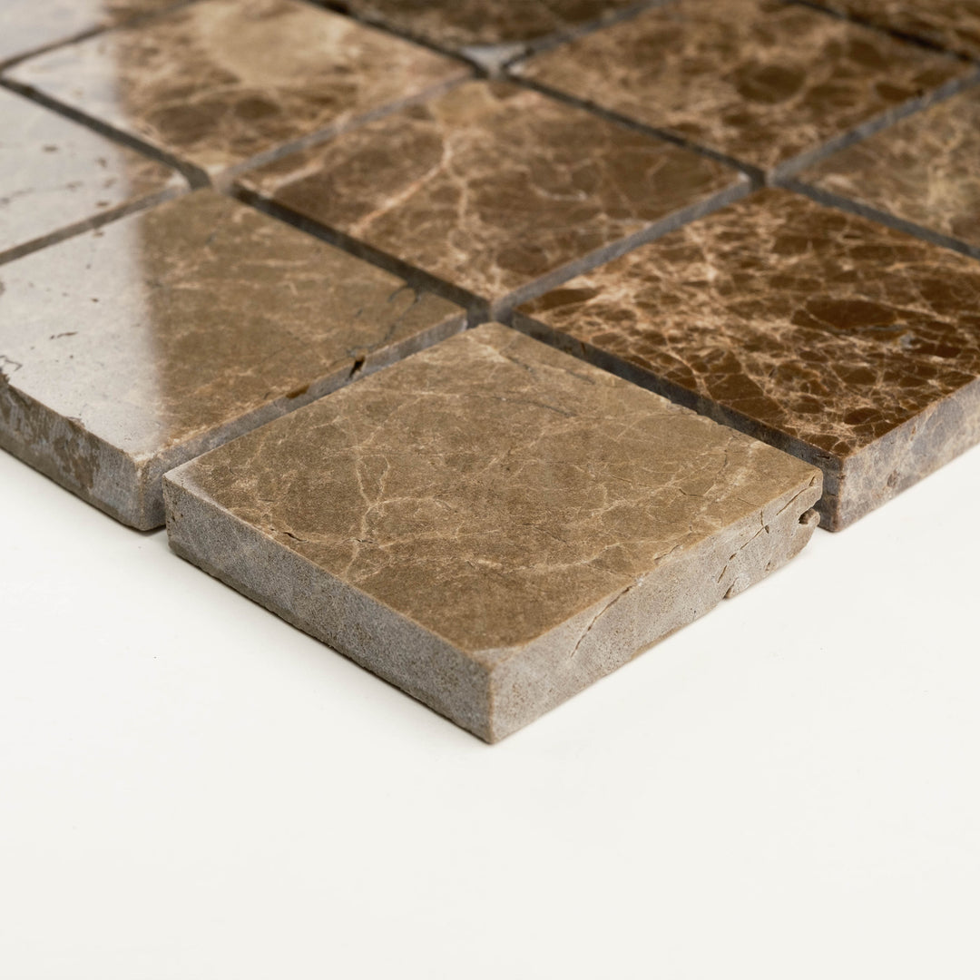 2 inch square mosaic in polished Emperador Dark marble, angled to reflect its larger scale format, smooth surface, and rich coloration.