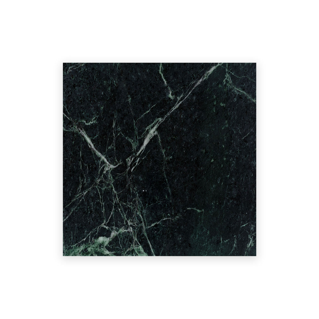 Overhead view of Empress Green Marble 12x12 polished tile, showcasing deep green tones with white veining and a glossy surface ideal for luxurious settings.