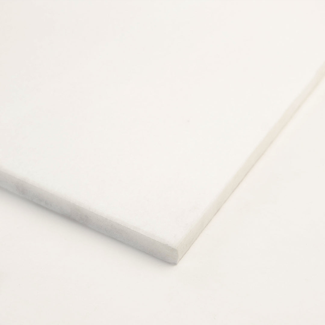 3x6 honed Thassos White marble tile, corner view highlights the crisp edges and ultra-white tone of this classic rectangular format.