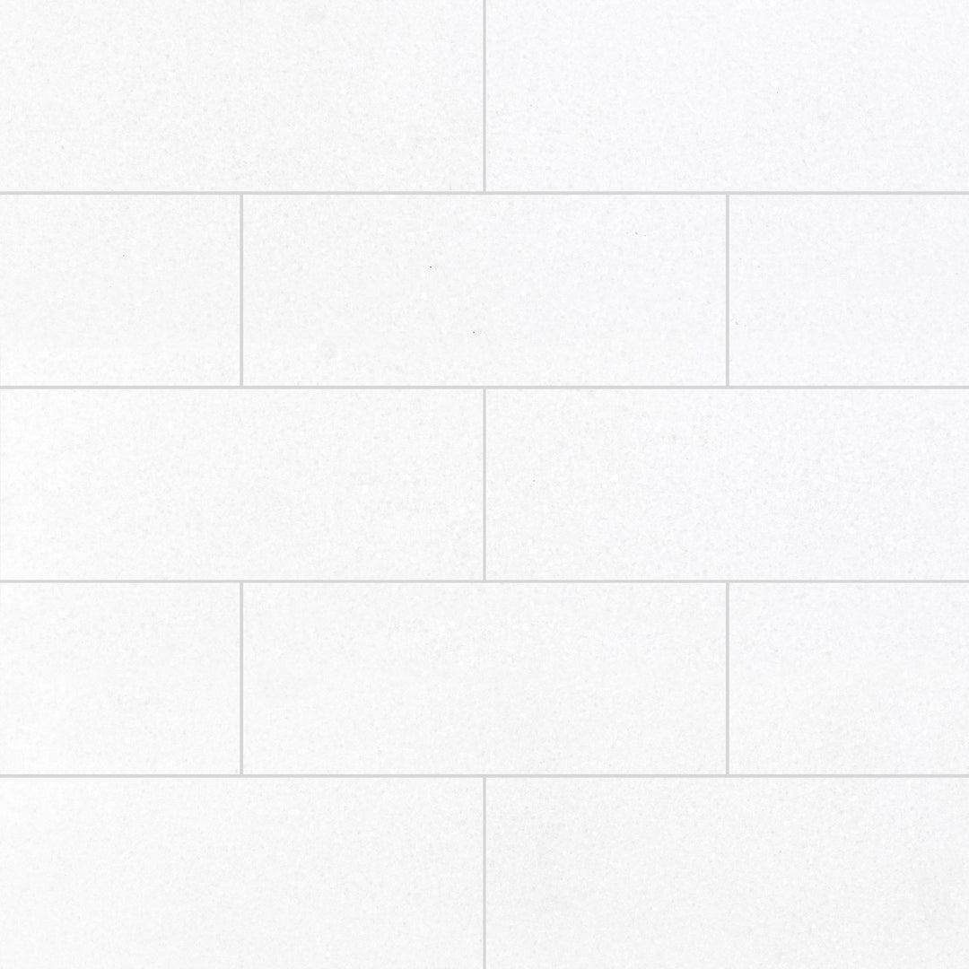 Thassos White Marble 4x12 Honed Tile delivers a refined matte surface with crisp linear form, perfect for clean, modern aesthetics.