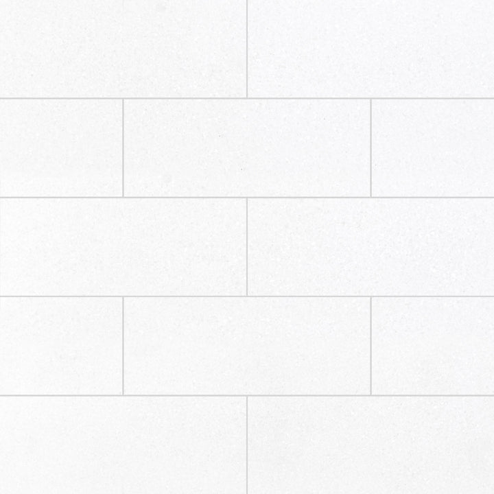 Thassos White Marble 4x12 Honed Tile delivers a refined matte surface with crisp linear form, perfect for clean, modern aesthetics.