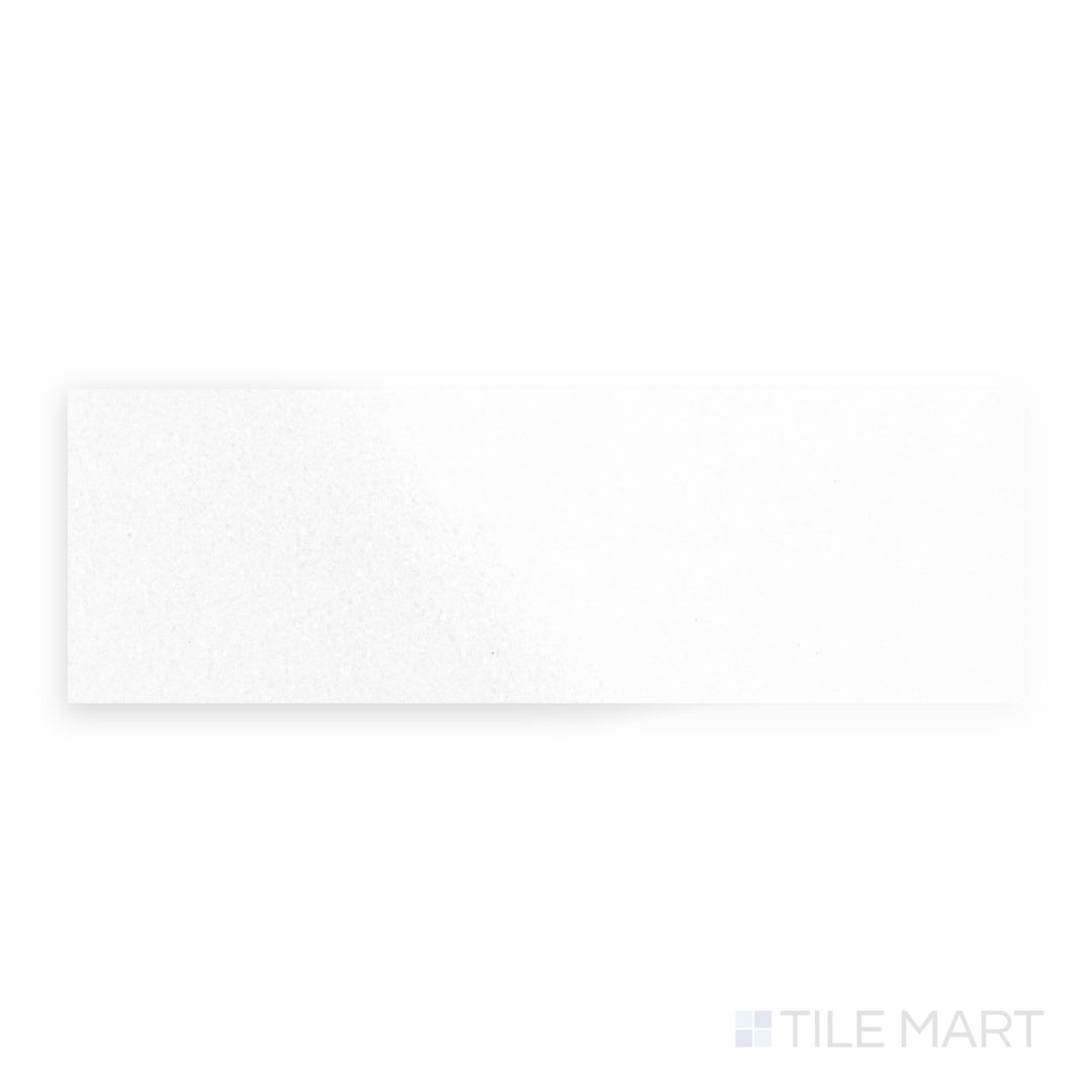 Polished 4x12 Thassos White Marble tile viewed from a top-down angle, delivering pristine white beauty and reflective sophistication.