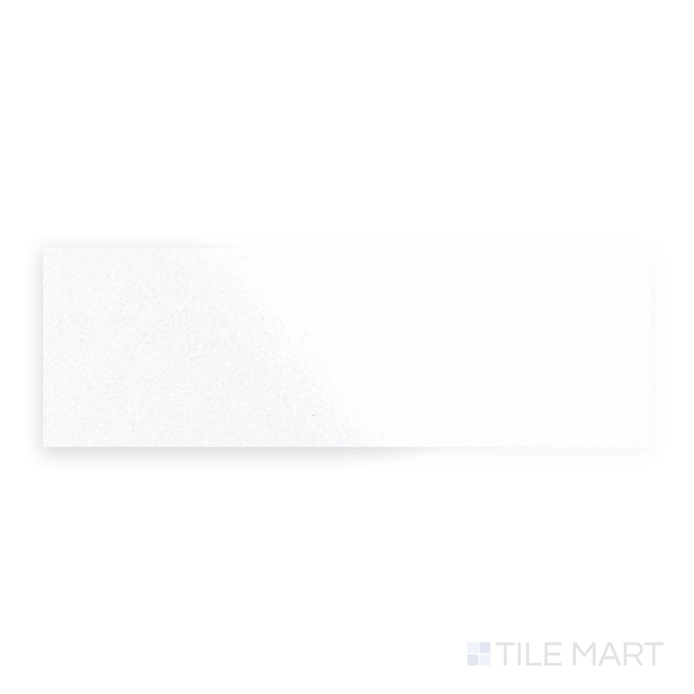 Polished 4x12 Thassos White Marble tile viewed from a top-down angle, delivering pristine white beauty and reflective sophistication.