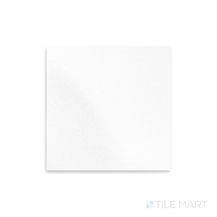 Polished 12x12 Thassos White Marble tile viewed from a top-down perspective, showcasing a reflective surface and clean, uniform tone.