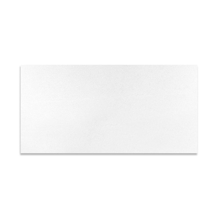 Top-down view of Thassos White Marble 12x24 tile in honed finish, highlighting its rectangular layout and soft matte finish in a radiant white hue.