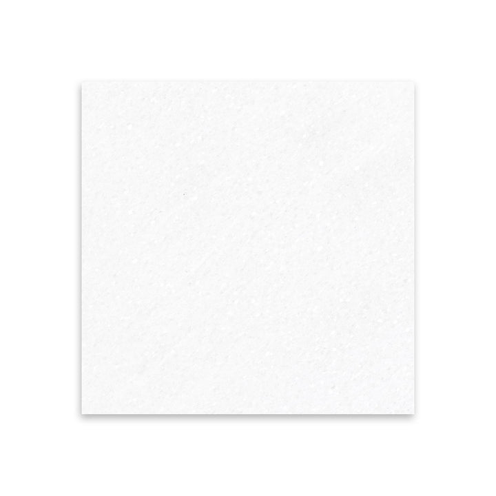 Thassos White Marble 18x18 tile in honed finish seen from above, offering a soft matte sheen and pure white color in a large square format.