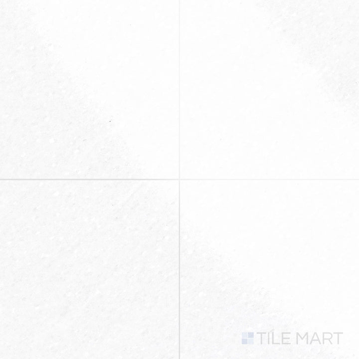 The polished finish of Thassos White Marble 18x18 Tile enhances its bright white stone, offering a bold and refined look.