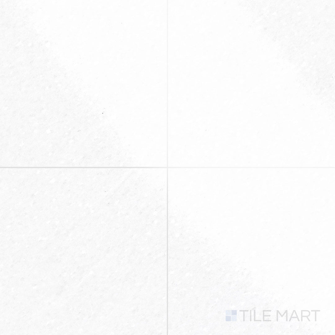 The polished finish of Thassos White Marble 18x18 Tile enhances its bright white stone, offering a bold and refined look.