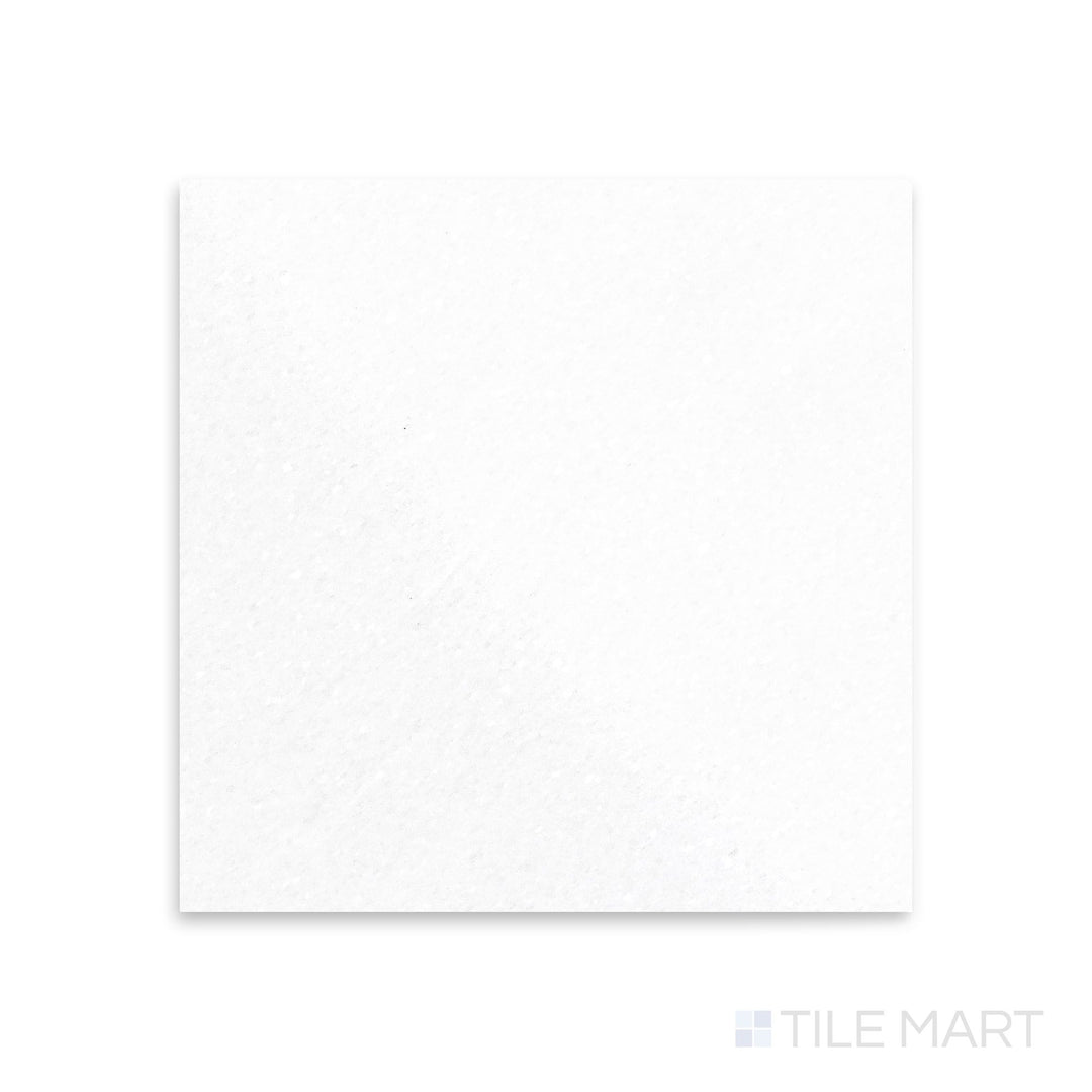 Polished 18x18 Thassos White Marble tile captured from a top-down view, delivering high-gloss shine with immaculate white tones.