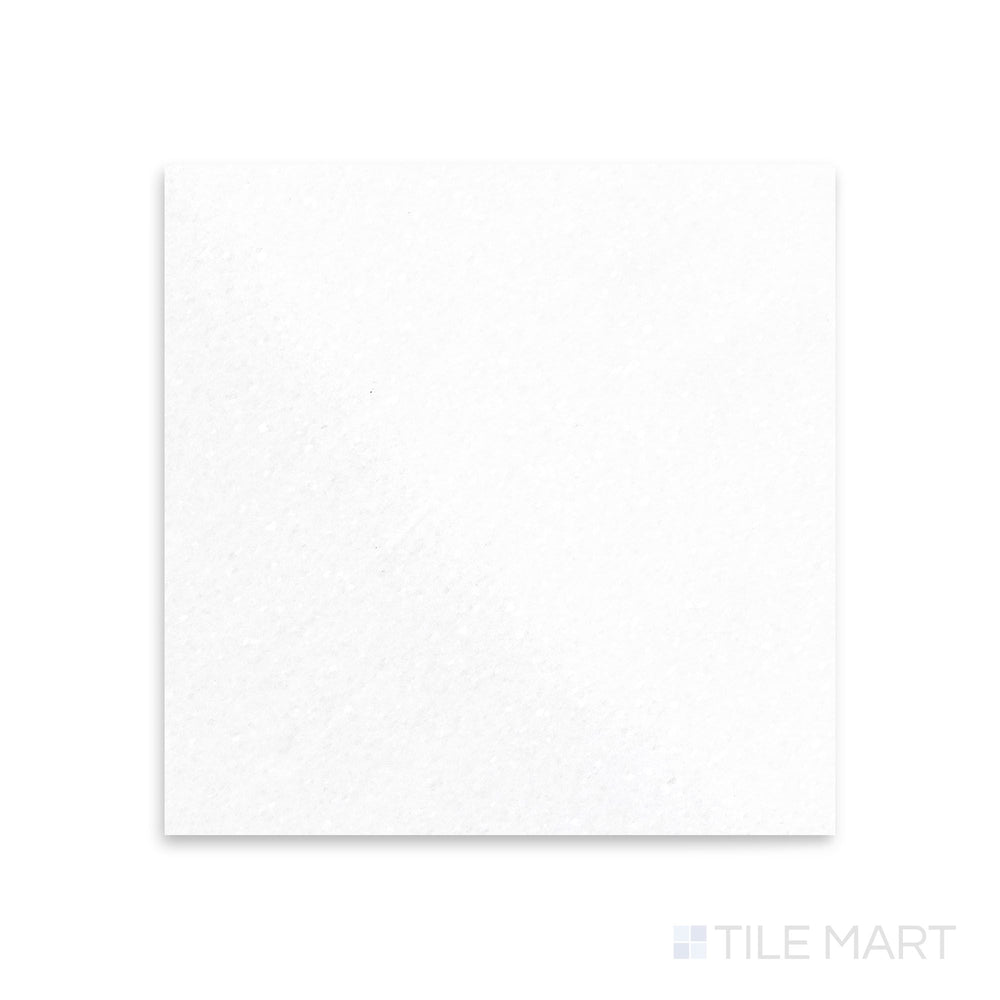 Polished 18x18 Thassos White Marble tile captured from a top-down view, delivering high-gloss shine with immaculate white tones.