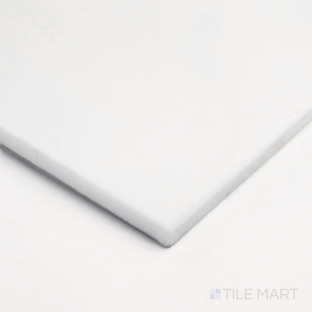 Seen from the corner, Thassos White Marble 18x18 polished tile captures bright reflection and clean white texture.