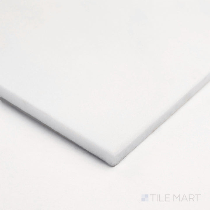 Seen from the corner, Thassos White Marble 18x18 polished tile captures bright reflection and clean white texture.