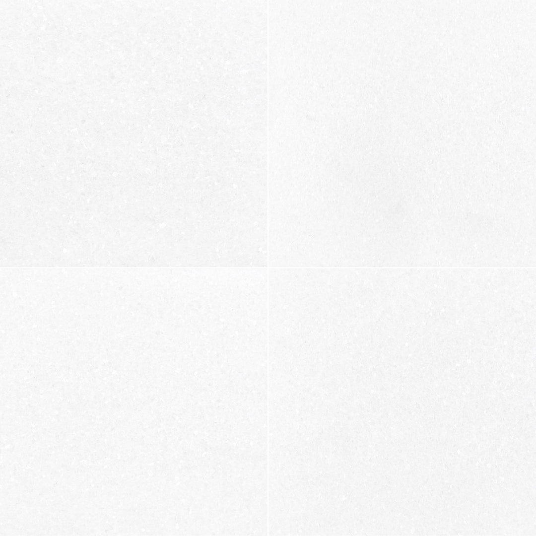 Thassos White Marble 24x24 Honed Tile showcases a grand square format and smooth honed surface for a serene, minimalist aesthetic.