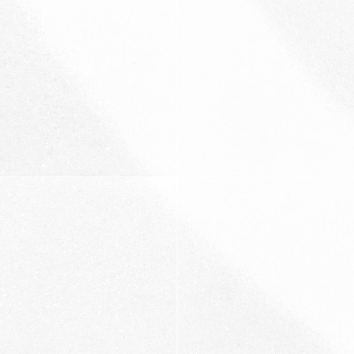 Elevating large spaces, the Thassos White Marble 24x24 Polished Tile provides a luminous finish and luxurious white appearance.