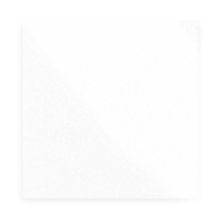 Top-down view of Thassos White Marble 24x24 polished tile, featuring a bright reflective surface with crisp white tone ideal for luxurious large spaces.