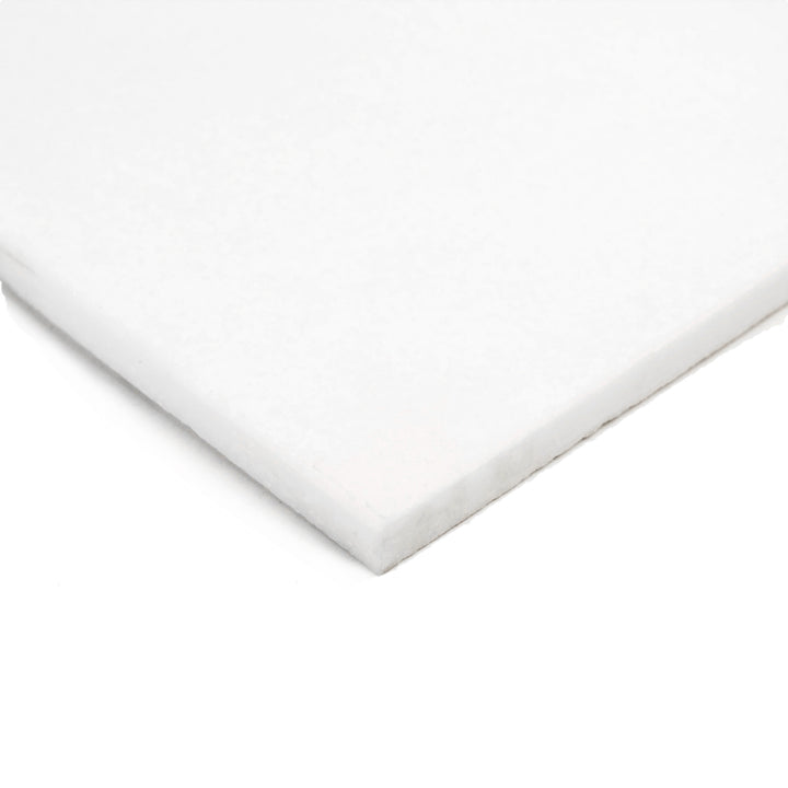 24x24 polished Thassos White marble tile shown at an angle, reflecting its pristine white brilliance and high-gloss surface for a luminous effect.