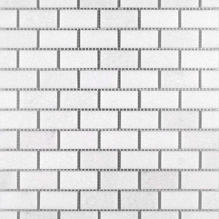 Overview of Thassos White Marble 1x2 Brick Honed Mosaic with smooth matte finish and clean, linear brick layout.