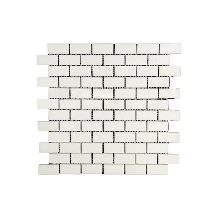 Polished 1x2 brick mosaic in Thassos White Marble seen from above, offering reflective surfaces and clean edges in a timeless brick layout.