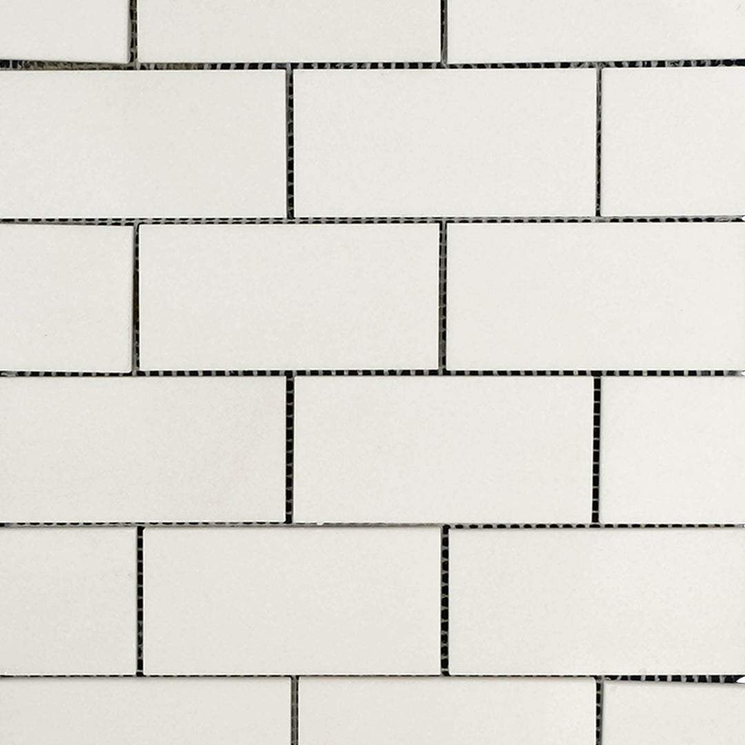Overview of Thassos White Marble 2x4 Brick Polished Mosaic emphasizing bright white tones and a sleek polished layout.