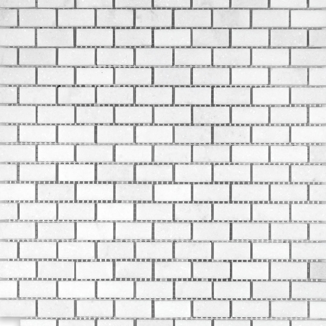 Overview of Thassos White Marble 5/8x1-1/4 Brick Honed Mosaic highlighting tight tile spacing and a honed finish.