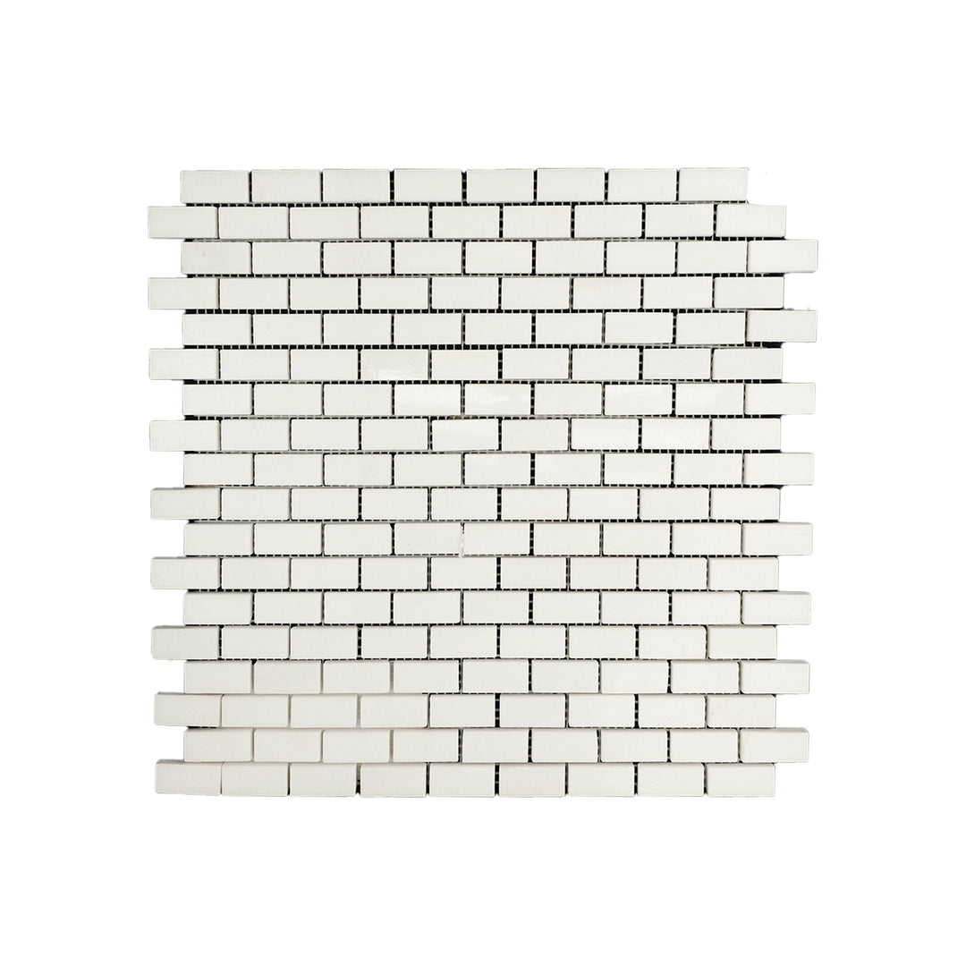 Polished 5/8 by 1-1/4 Thassos White Marble brick mosaic captured from a top view, featuring compact design and luminous marble finish.