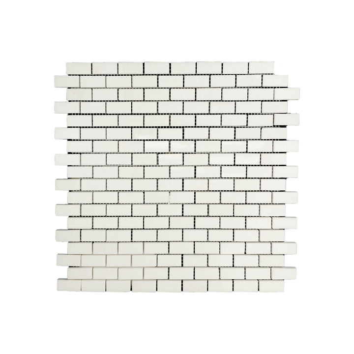 Polished 5/8 by 1-1/4 Thassos White Marble brick mosaic captured from a top view, featuring compact design and luminous marble finish.