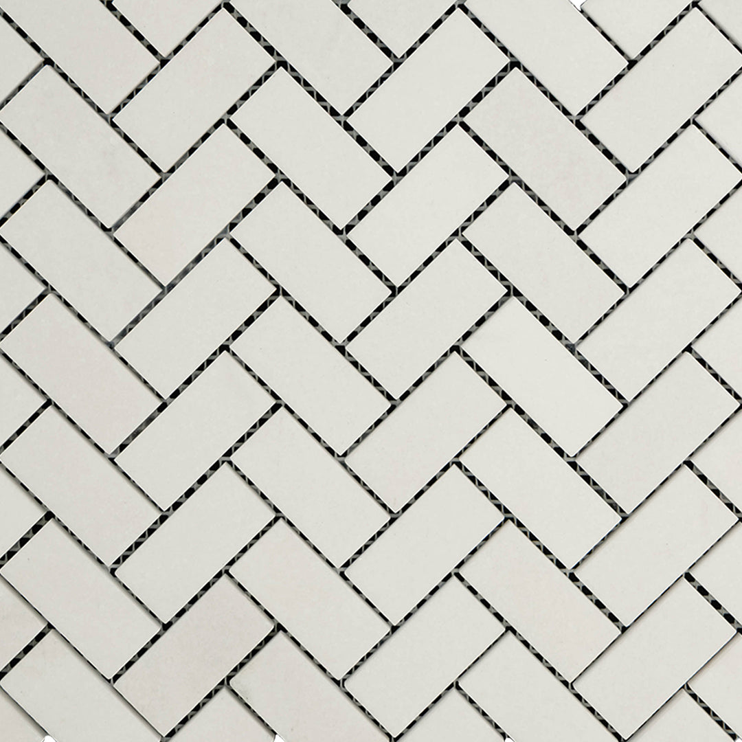 Overview of Thassos White Marble 1x2 Herringbone Honed Mosaic showing classic herringbone design in a soft matte finish.