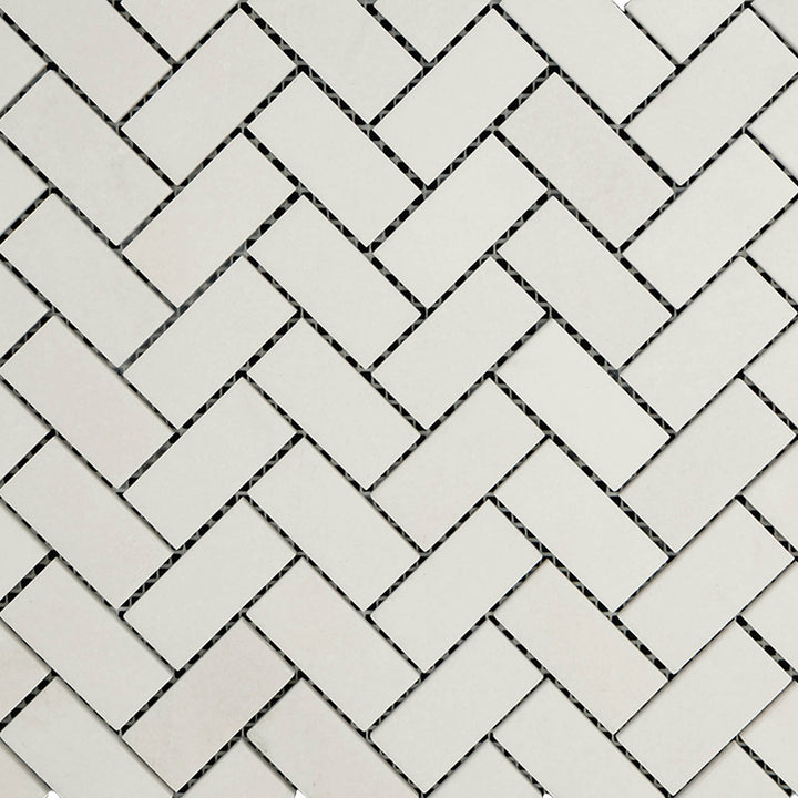 Overview of Thassos White Marble 1x2 Herringbone Honed Mosaic showing classic herringbone design in a soft matte finish.