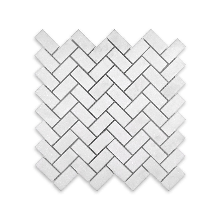 Polished Thassos White Marble 1x2 herringbone mosaic viewed from above, offering refined angles and glossy finish for clean, contemporary spaces.