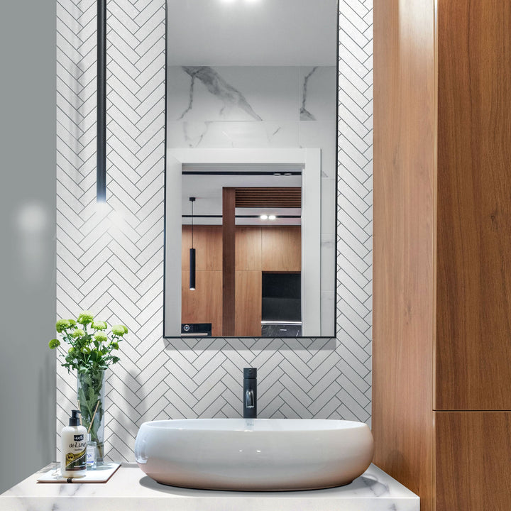 Modern bathroom with a sink, mirror, and decorative elements.
