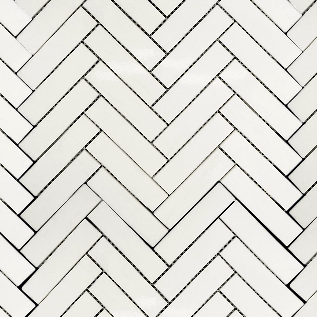 Overview of Thassos White Marble 1x4 Herringbone Honed Mosaic featuring bright white marble in an extended matte herringbone design.