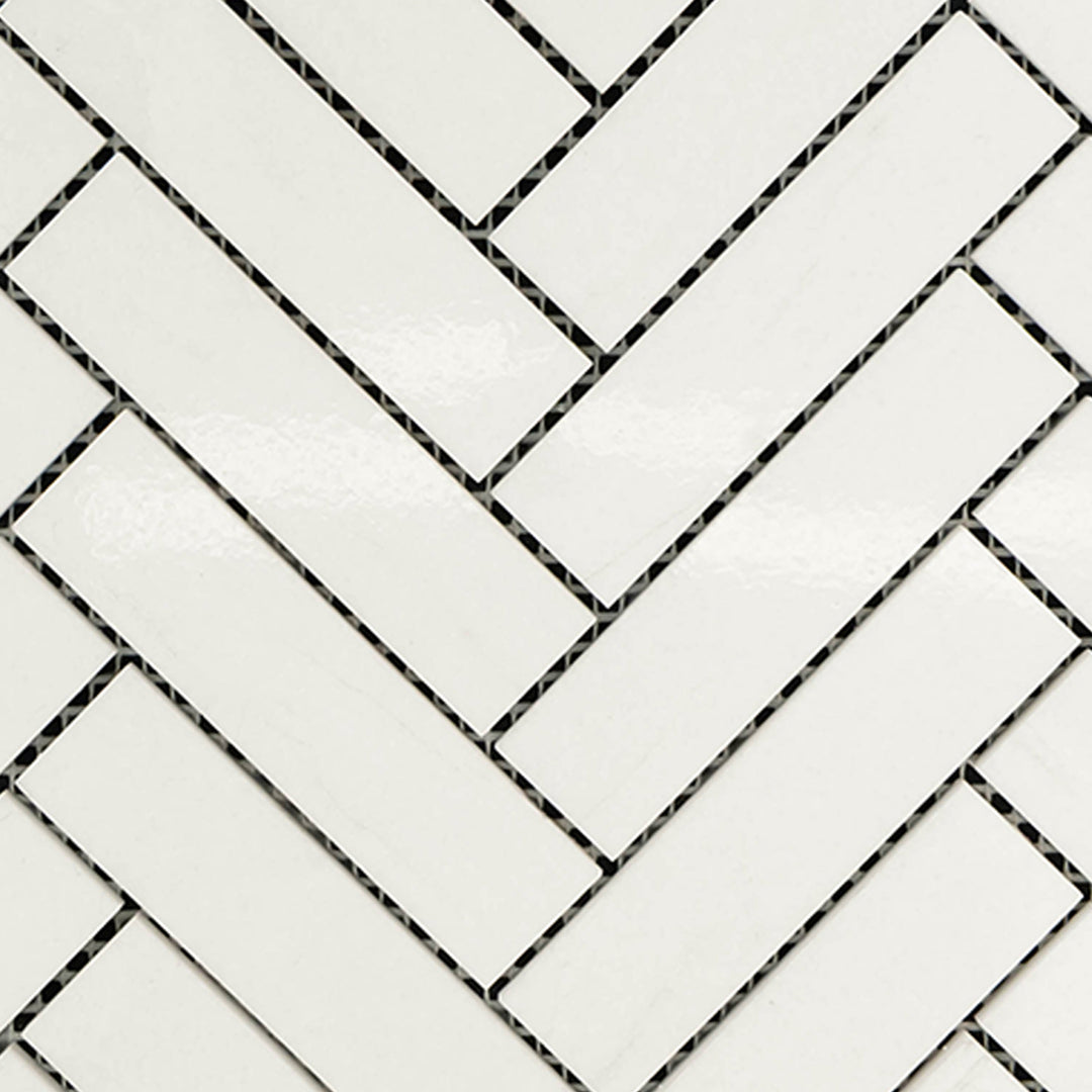 Full view of Thassos White Marble 1x4 Herringbone Polished Mosaic highlighting elongated polished tiles in a sleek herringbone layout.