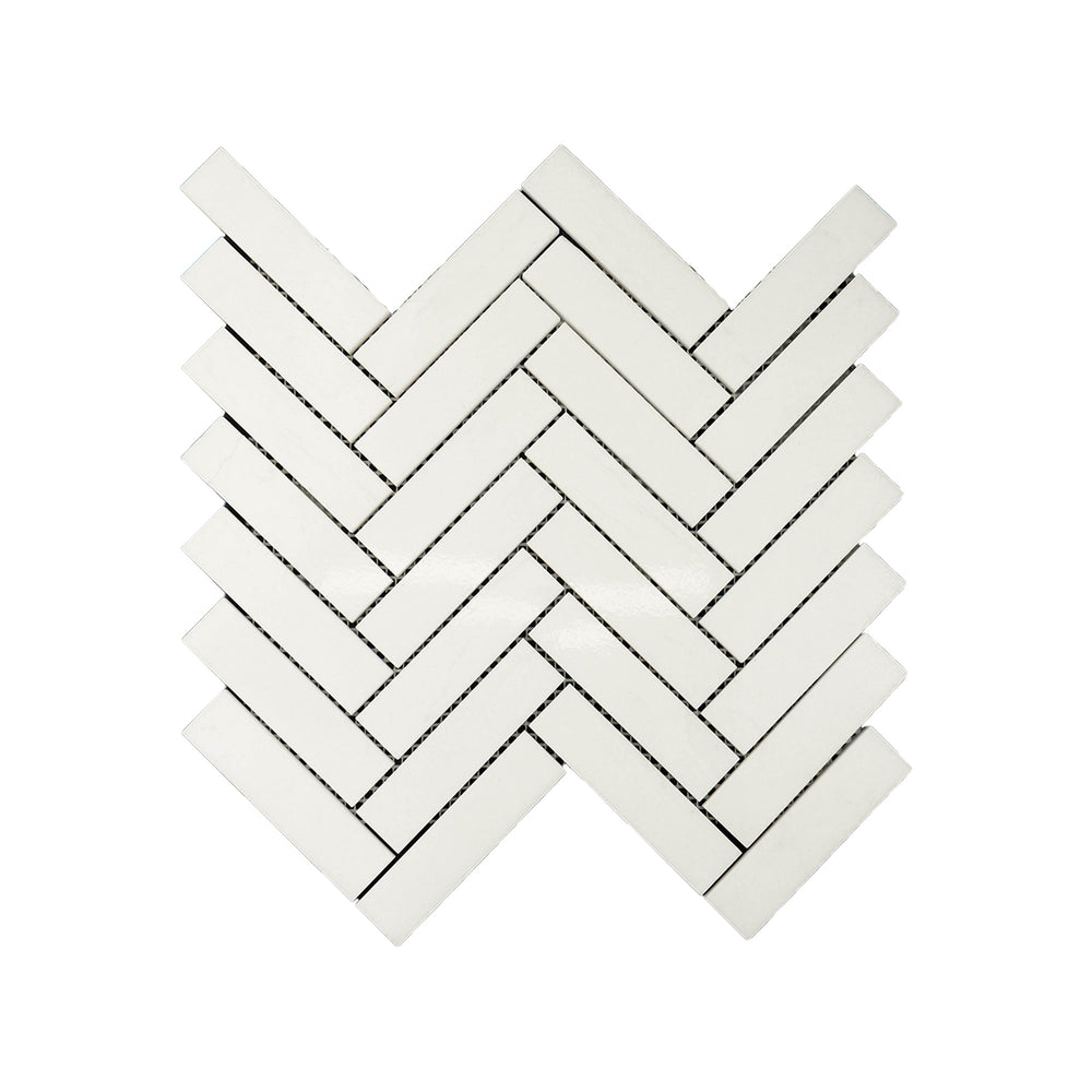 Polished Thassos White Marble 1x4 herringbone mosaic captured from above, showcasing bright white marble with sleek lines and elegant patterning.