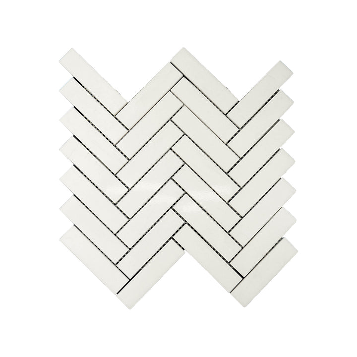 Polished Thassos White Marble 1x4 herringbone mosaic captured from above, showcasing bright white marble with sleek lines and elegant patterning.