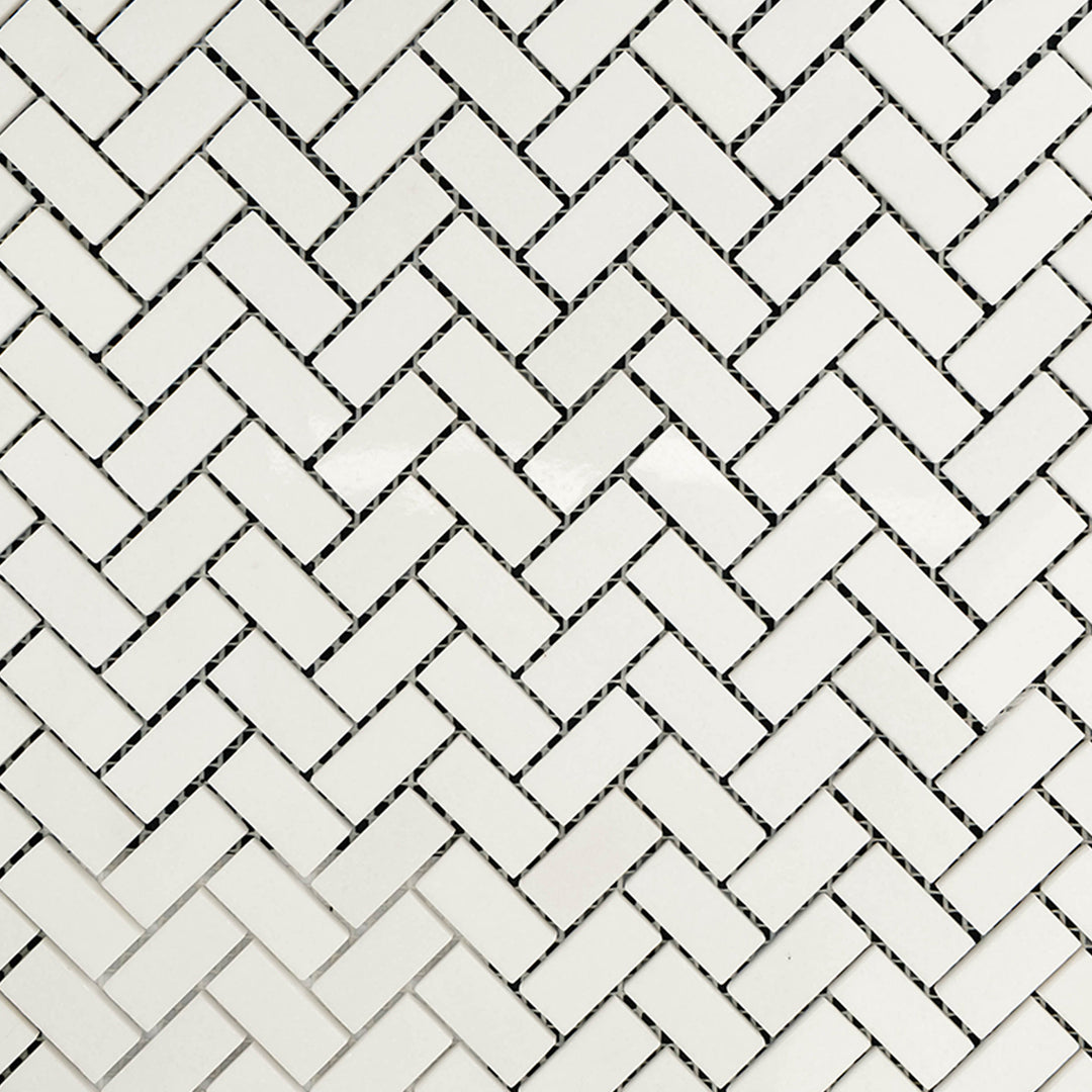 Clean view of Thassos White Marble 5/8x1-1/4 Herringbone Polished Mosaic showcasing polished mini tiles in a sharp, elegant herringbone pattern.