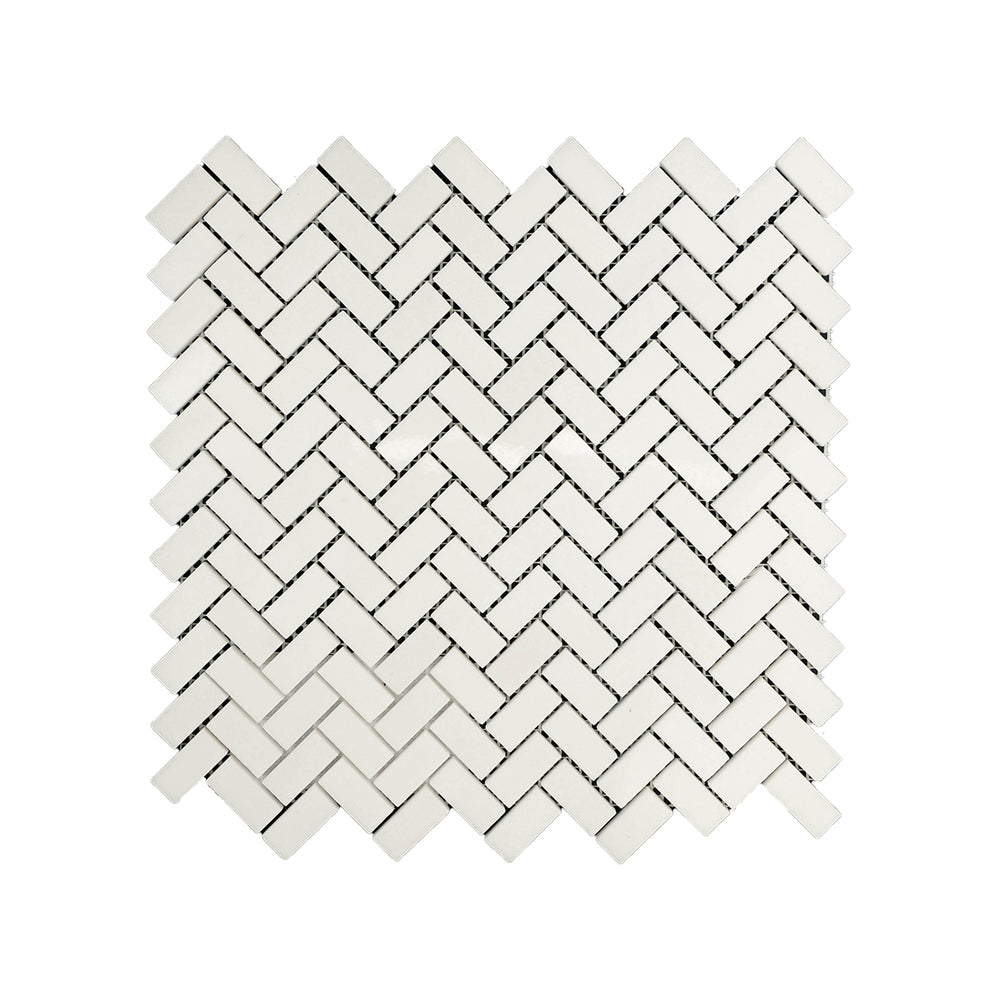 Polished 5/8 by 1-1/4 herringbone mosaic in Thassos White Marble seen from above, combining fine detail and high-shine surface in a modern pattern.