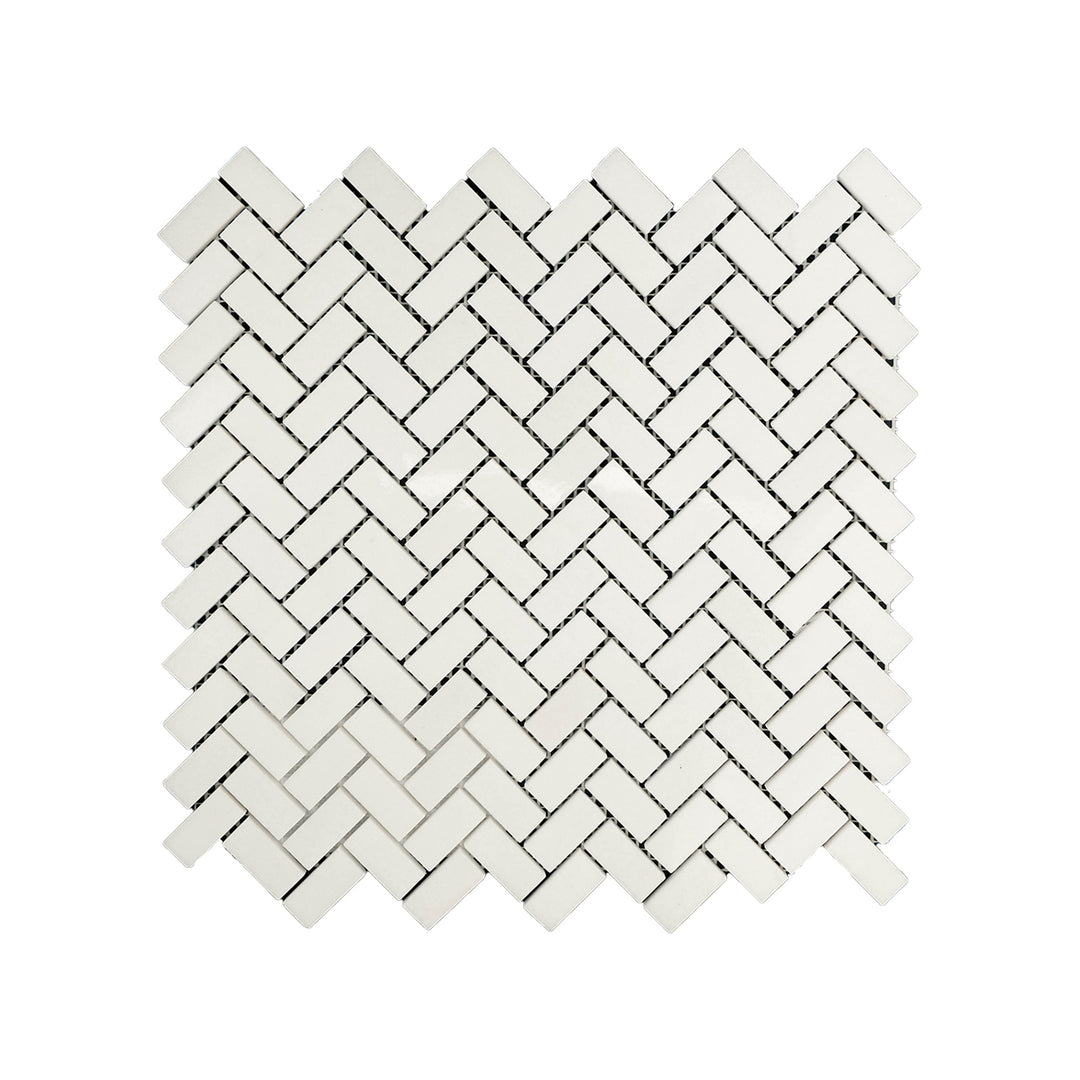 Polished 5/8 by 1-1/4 herringbone mosaic in Thassos White Marble seen from above, combining fine detail and high-shine surface in a modern pattern.