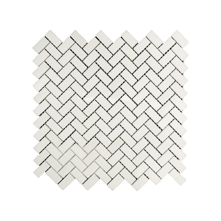 Polished 5/8 by 1-1/4 herringbone mosaic in Thassos White Marble seen from above, combining fine detail and high-shine surface in a modern pattern.