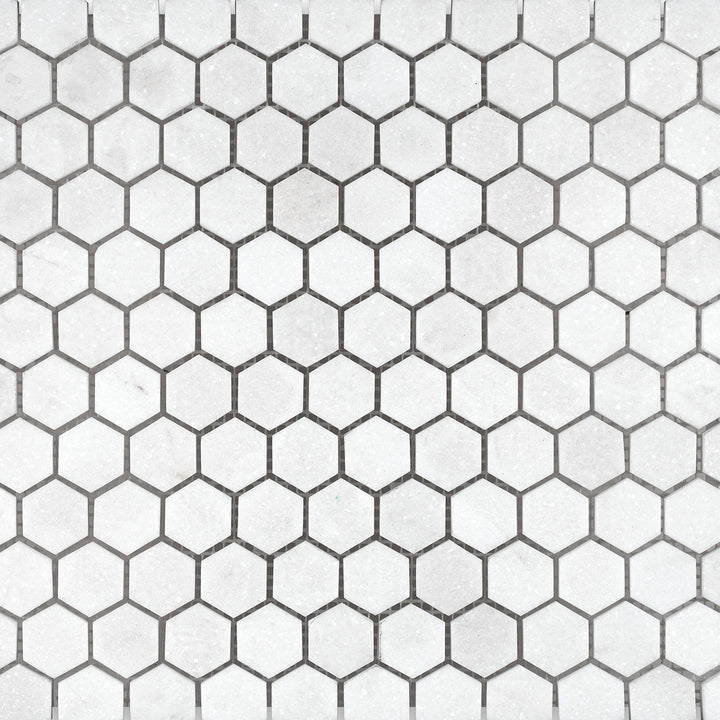 Surface view of Thassos White Marble 1" Hexagon Honed Mosaic showcasing matte-finished hexagon tiles with clean, geometric appeal.