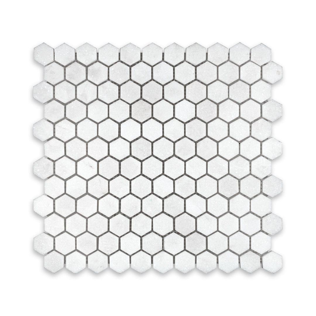 Top-down image of Thassos White Marble 1 inch hexagon mosaic in honed finish, presenting a classic honeycomb layout with soft white matte texture.