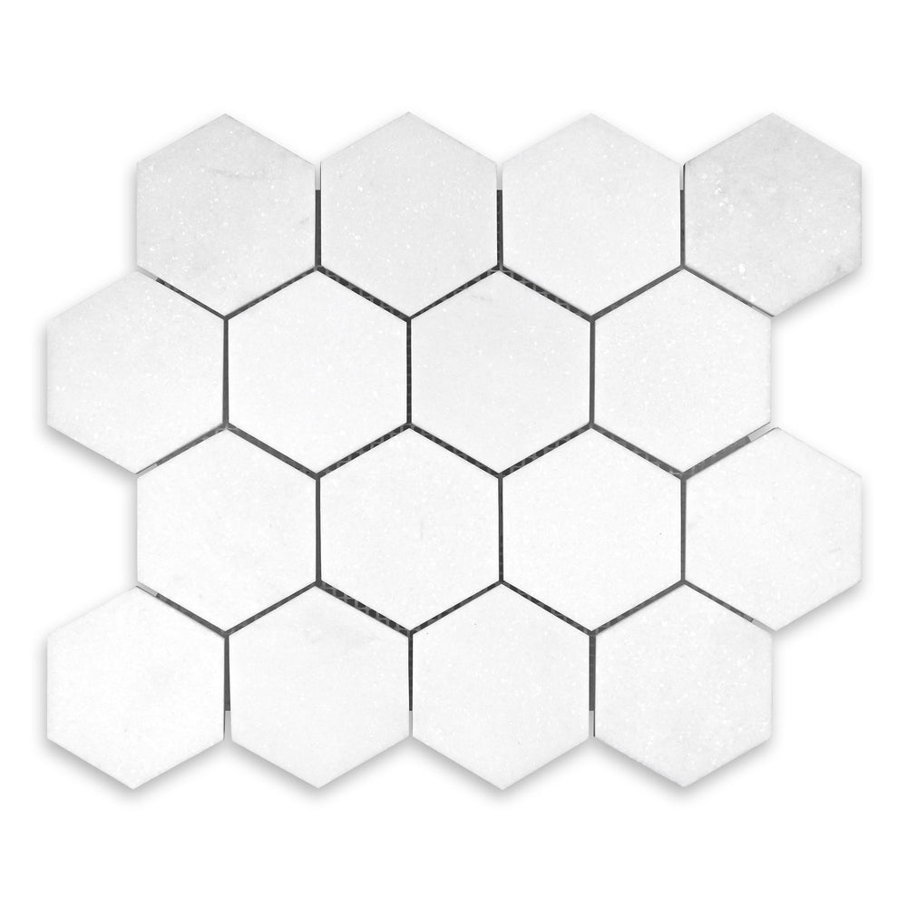Overhead image of Thassos White Marble 3 inch hexagon mosaic in honed finish, offering classic hex style with refined edges and soft white texture.