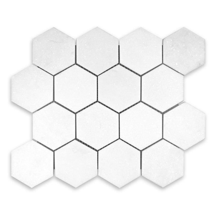 Overhead image of Thassos White Marble 3 inch hexagon mosaic in honed finish, offering classic hex style with refined edges and soft white texture.
