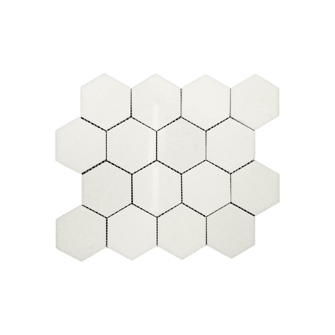 Polished Thassos White Marble 3 inch hexagon mosaic viewed from above, combining radiant finish and geometric pattern in a pristine white palette.