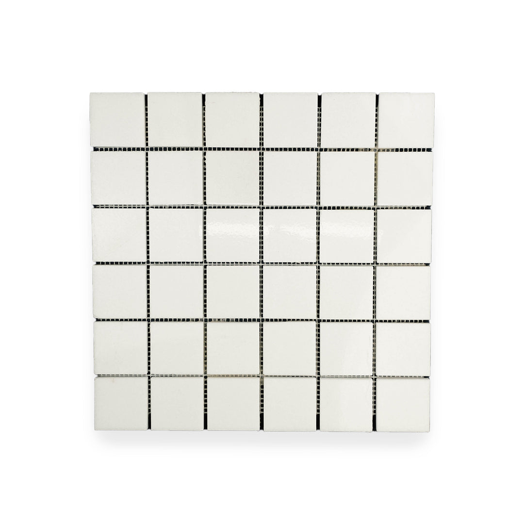 Polished Thassos White Marble 2 inch square mosaic seen from above, combining uniform white color and glossy surface for a refined look.