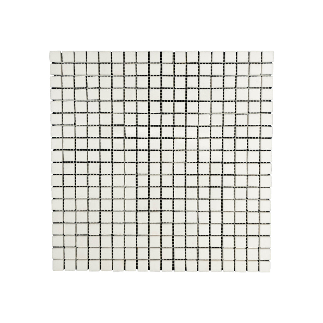 Top-down shot of Thassos White Marble 5/8 inch square mosaic in polished finish, presenting crisp white squares with a bright, reflective surface.
