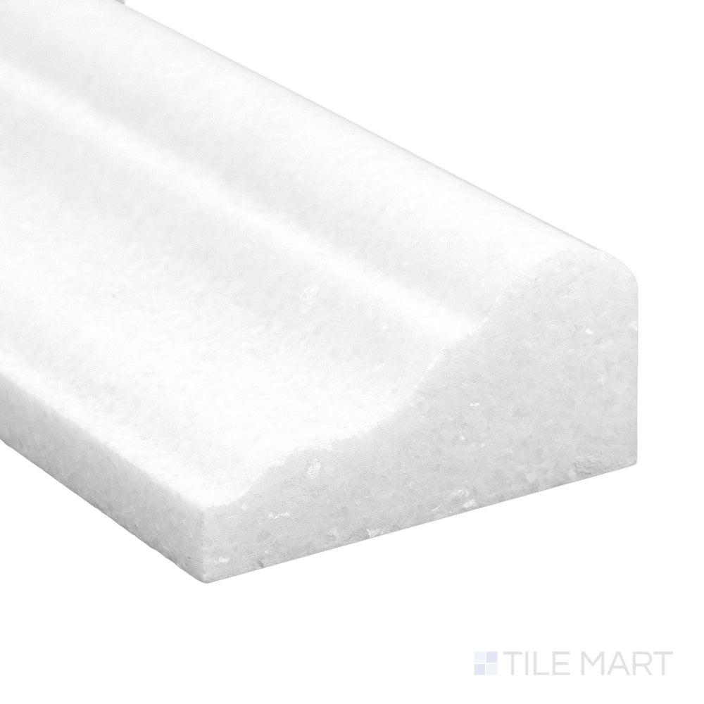 A refined corner view of Thassos White Marble 2x12 honed grand chair rail showing soft matte surface and pure tone.